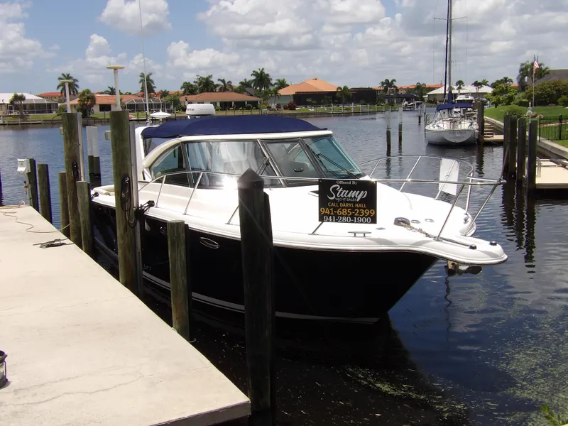 Slide: The Image of 2012 Tiara Yachts 3100 Coronet docked in a marina. - 10