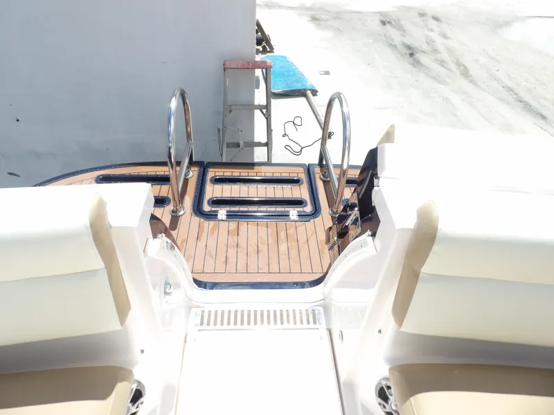 Slide: The Image of 2012 Tiara Yachts 3100 Coronet swim platform with teak decking and stainless steel handrails. - 16