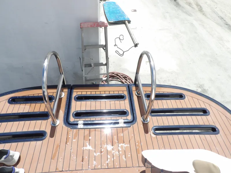 Slide: The Image of 2012 Tiara Yachts 3100 Coronet swim platform with stainless steel handrails. - 17