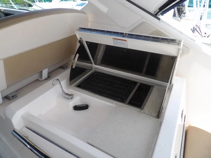 Slide: The Image of Tiara Yachts 3100 Coronet 2012 boat interior with sink and grill. - 21