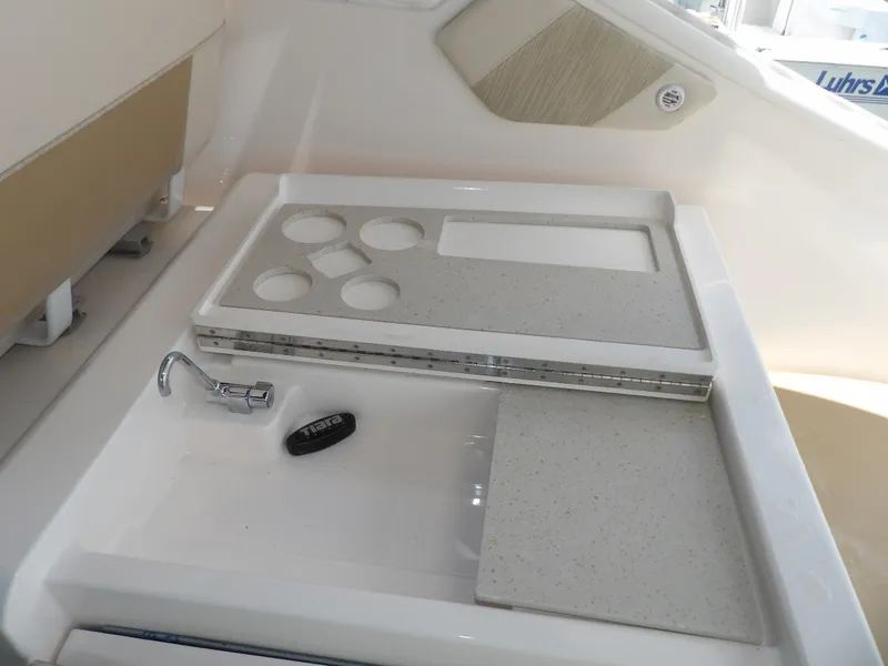 Slide: The Image of Tiara Yachts 3100 Coronet 2012 model sink and countertop with cup holders. - 22