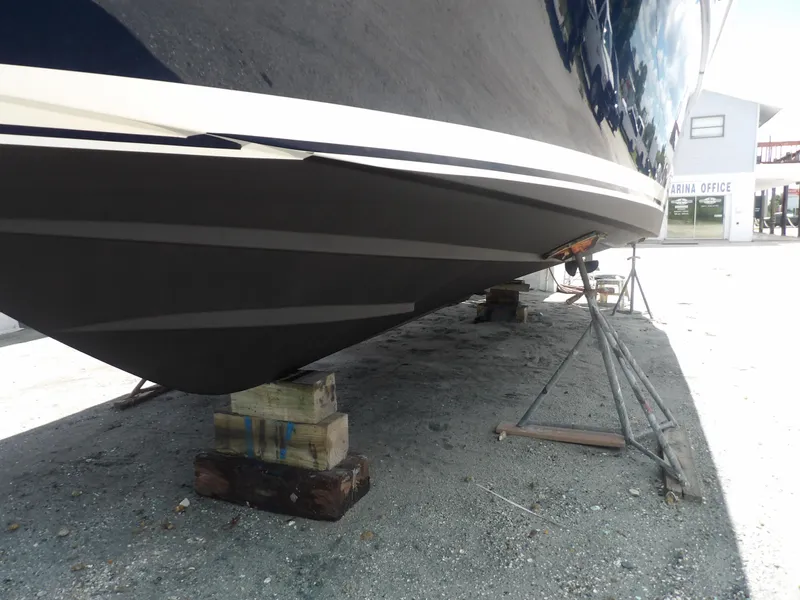 Slide: The Image of 2012 Tiara Yachts 3100 Coronet on dry dock, supported by blocks and stands. - 4