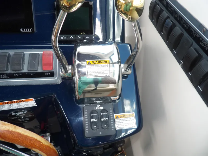 Slide: The Image of 2012 Tiara Yachts 3100 Coronet control panel with throttle and switches. - 40