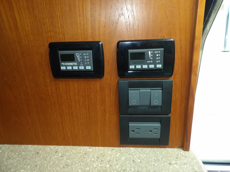 Slide: The Image of Control panel and switches on a 2012 Tiara Yachts 3100 Coronet. - 47