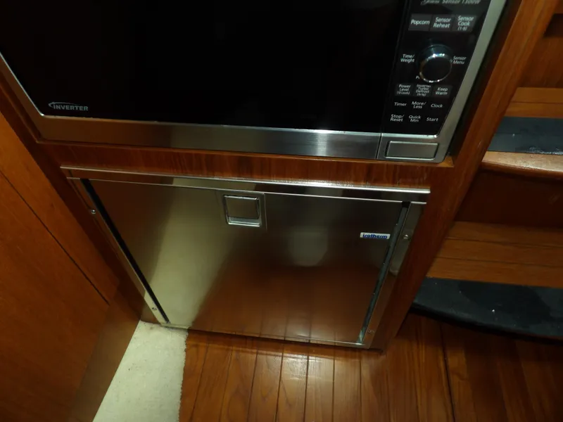 Slide: The Image of Stainless steel microwave and refrigerator in 2012 Tiara Yachts 3100 Coronet. - 49