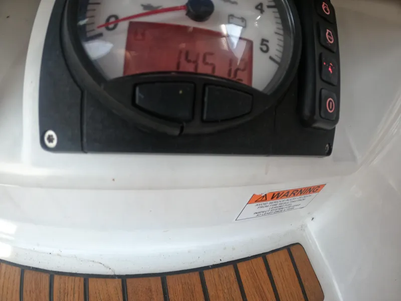 Slide: The Image of Instrument panel of a 2017 Jeanneau 54 sailboat showing 1451.2 hours. - 26