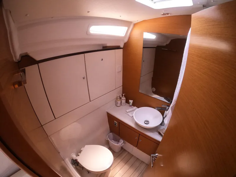 Slide: The Image of Luxurious bathroom in 2017 Jeanneau 54 yacht with modern fixtures and wooden accents. - 35