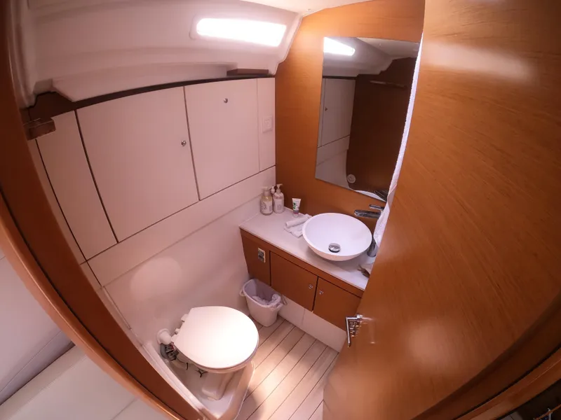 Slide: The Image of Modern bathroom in 2017 Jeanneau 54 yacht with wood accents and sleek fixtures. - 36