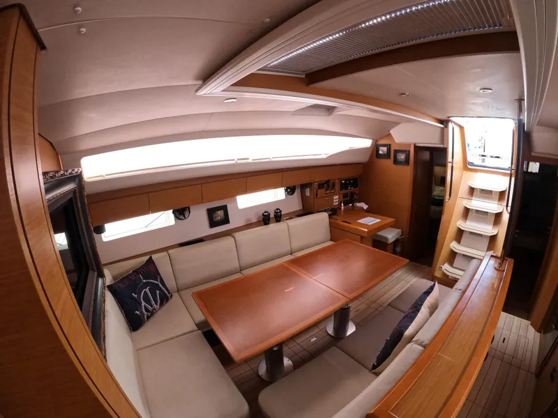 Slide: The Image of Interior of 2017 Jeanneau 54 yacht with elegant dining area and wooden finishes. - 39