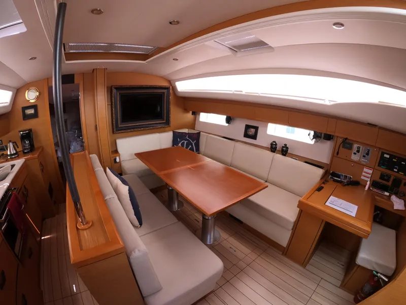 Slide: The Image of Interior of 2017 Jeanneau 54 yacht with elegant dining area and modern amenities. - 40