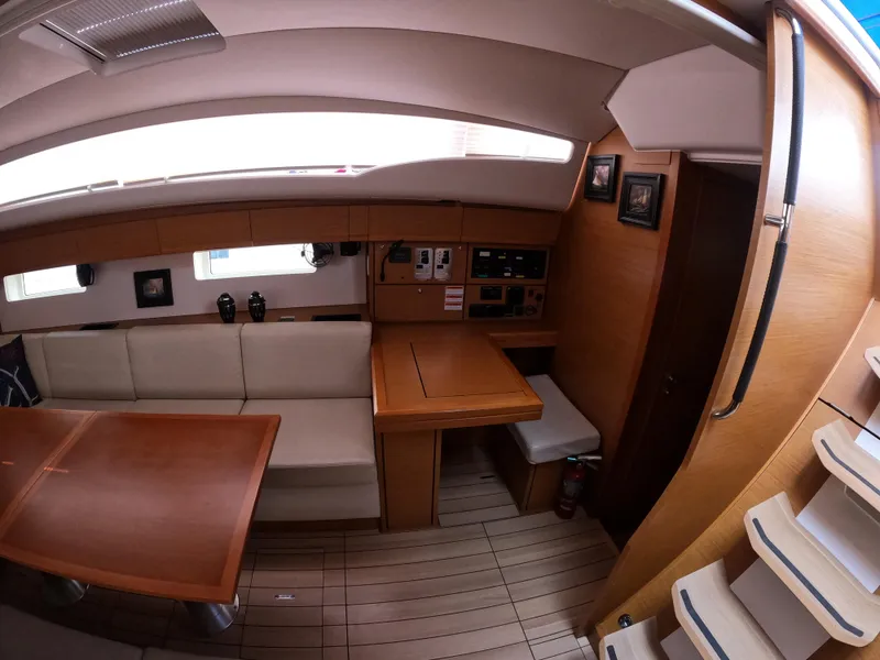 Slide: The Image of Interior of 2017 Jeanneau 54 yacht with wooden furnishings and seating area. - 41