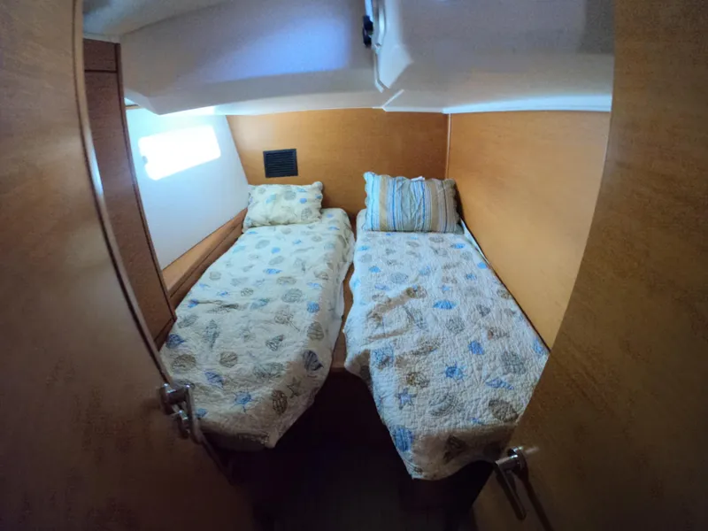 Slide: The Image of Cozy twin cabin in 2017 Jeanneau 54 yacht with natural light. - 43
