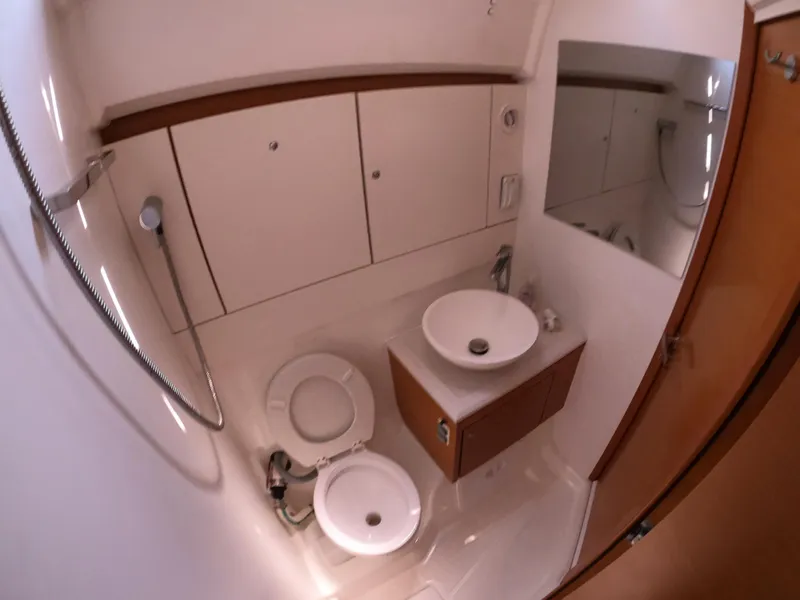 Slide: The Image of Modern bathroom in 2017 Jeanneau 54 yacht with sink, toilet, and shower. - 44