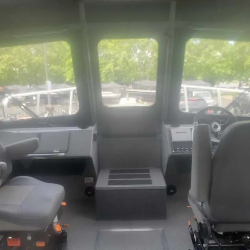 Slide: The Image of Interior cockpit of 2024 Spartan Maximus 240 boat with dual seats and control panel. - 2