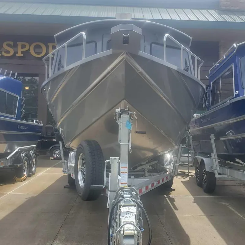Slide: The Image of 2024 Spartan Maximus 240 boat on trailer at dealership. - 4