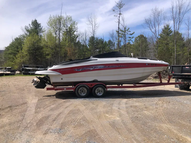 The Image of 2007 Crownline 240 EX boat on trailer in outdoor setting. - 1