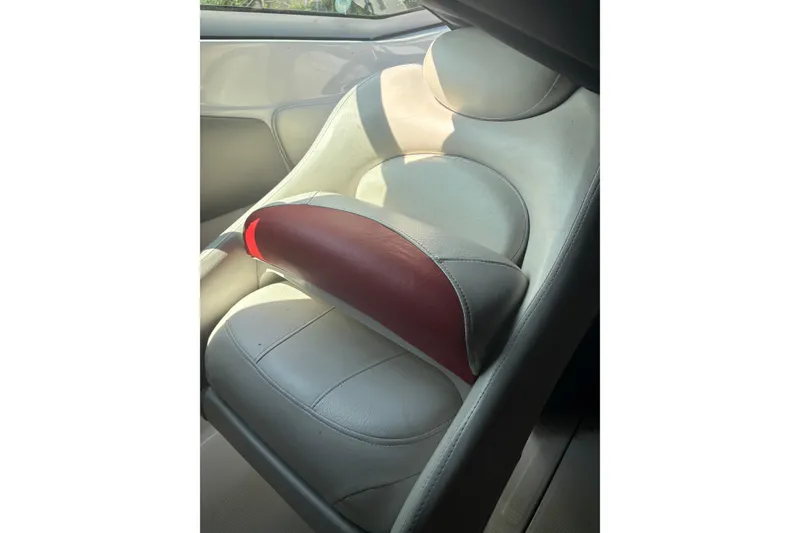 Slide: The Image of 2007 Crownline 240 EX boat seat with white and red leather upholstery. - 19