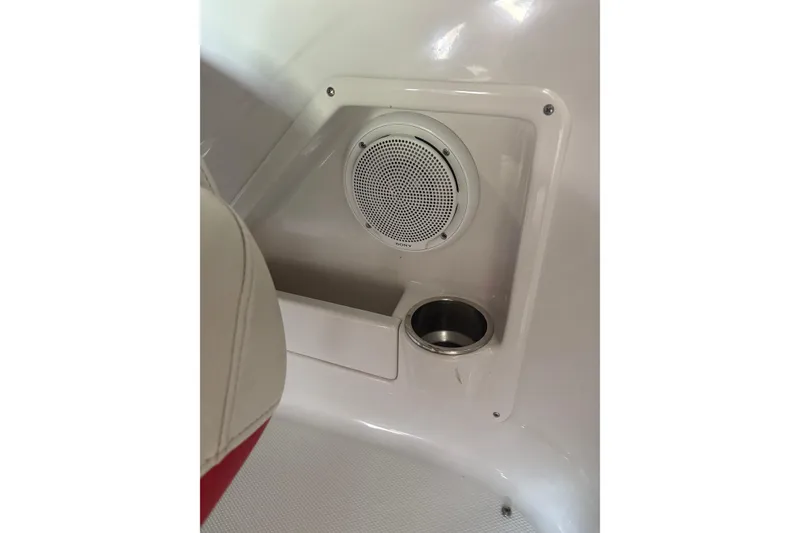 Slide: The Image of 2007 Crownline 240 EX boat interior with speaker and cup holder detail. - 22
