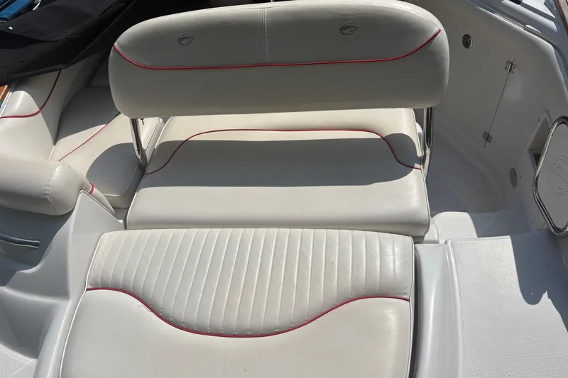 Slide: The Image of 2007 Crownline 240 EX boat interior with white and red-trimmed seating. - 25