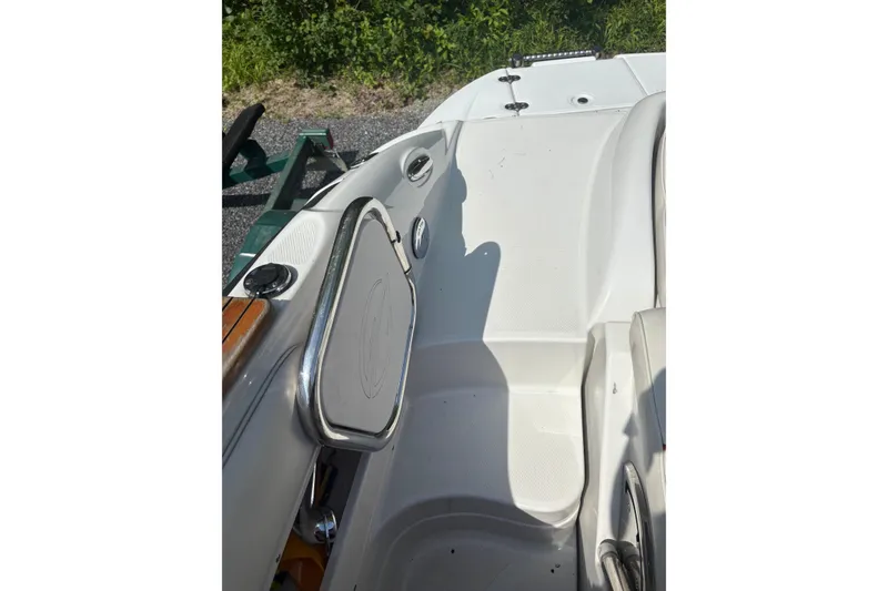 Slide: The Image of 2007 Crownline 240 EX boat interior with seating and stainless steel railings. - 34