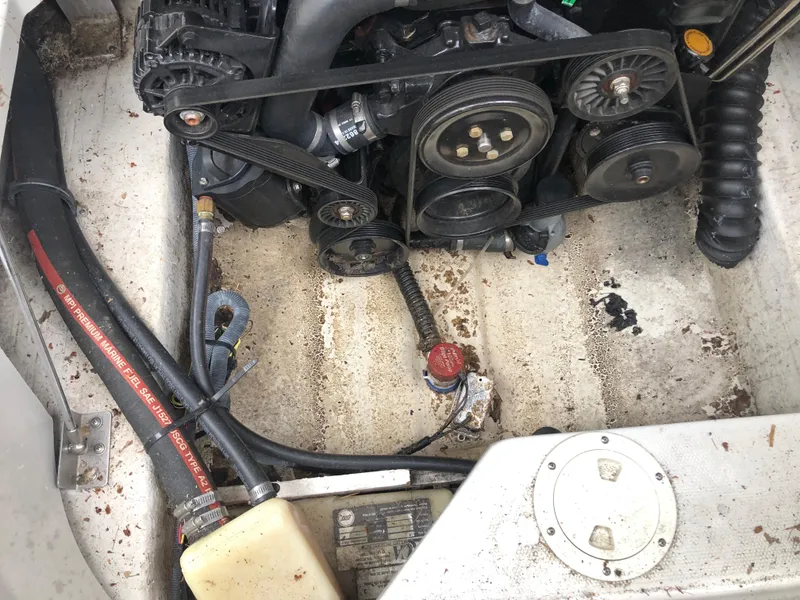 Slide: The Image of Engine compartment of a 2007 Crownline 240 EX boat, showing belts and hoses. - 6