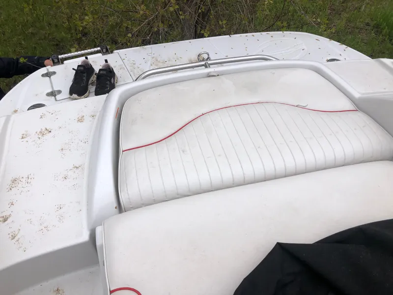 Slide: The Image of 2007 Crownline 240 EX boat with white seating and red trim, featuring a swim platform. - 8