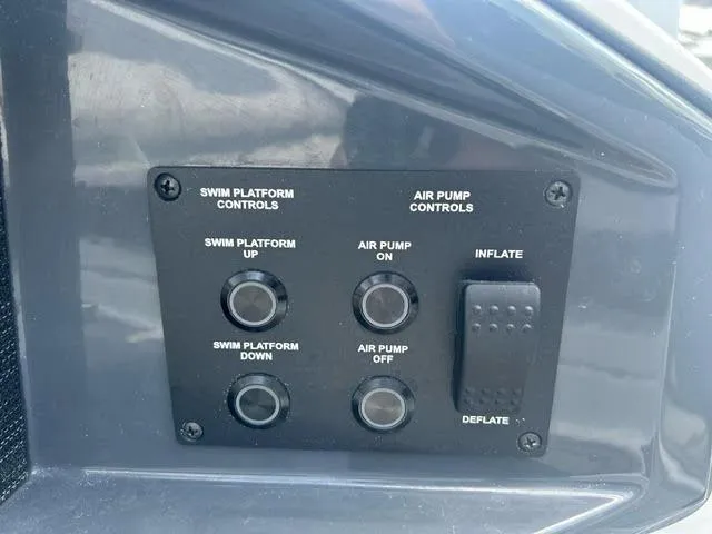 Slide: The Image of Control panel of a 2022 Cobalt A29 boat with swim platform and air pump controls. - 19