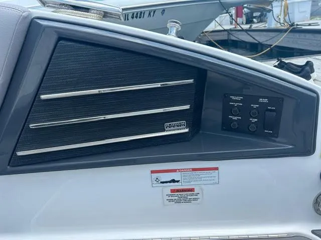 Slide: The Image of 2022 Cobalt A29 boat dashboard with control panel and warning labels. - 20