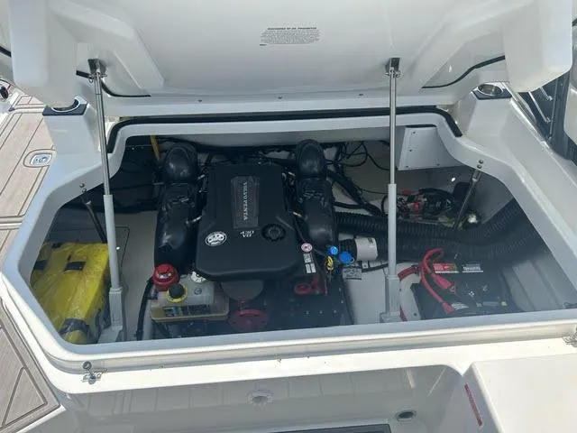 Slide: The Image of 2022 Cobalt A29 boat engine compartment with open hatch. - 28