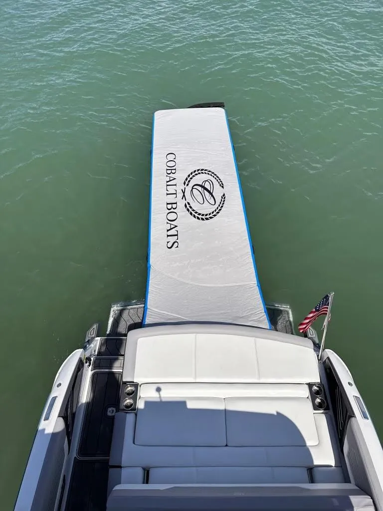 Slide: The Image of 2022 Cobalt A29 boat with extended swim platform on water. - 37