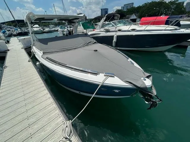 Slide: The Image of 2022 Cobalt A29 boat docked with cover on, in a marina. - 4