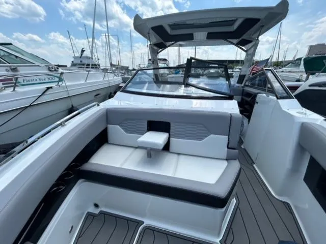 Slide: The Image of 2022 Cobalt A29 boat interior with seating, docked at marina. - 6