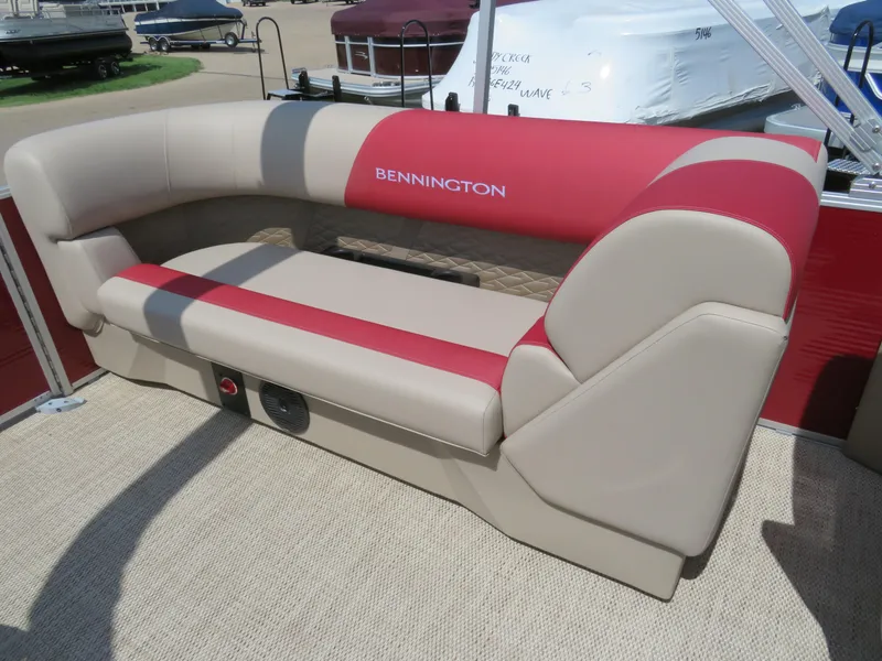 Slide: The Image of 2024 Bennington 22SSR boat seating with red and beige upholstery. - 12