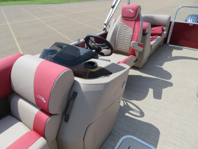 Slide: The Image of 2024 Bennington 22SSR boat interior with red and beige seating and steering console. - 15