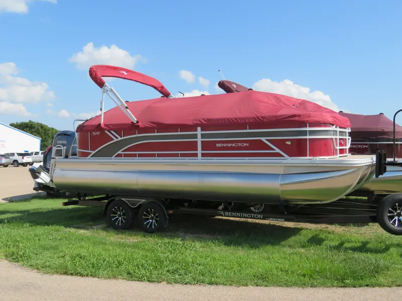Slide: The Image of 2024 Bennington 22SSR pontoon boat with red canopy on a trailer. - 16