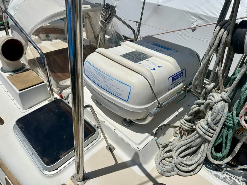 Slide: The Image of Alden 44 sailboat deck with liferaft and coiled ropes, 1980 model. - 19