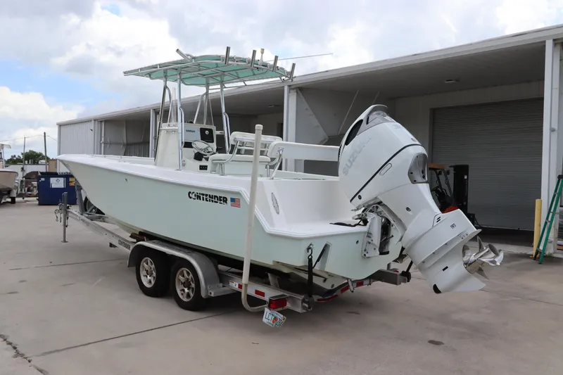 Slide: The Image of 2012 Contender 25 Tournament boat on trailer, docked at marina. - 3
