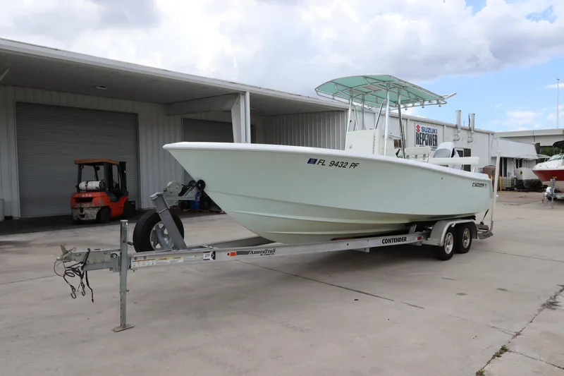 Slide: The Image of 2012 Contender 25 Tournament boat on trailer in a marina. - 5