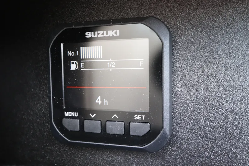 Slide: The Image of Suzuki fuel gauge on 2007 Sea Ray 240 Sundeck boat dashboard. - 25