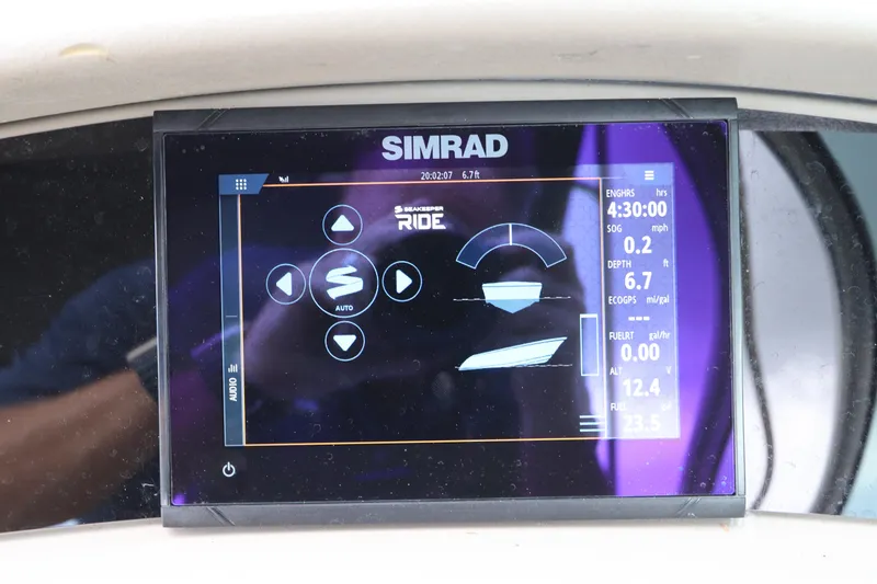 Slide: The Image of Simrad display on 2007 Sea Ray 240 Sundeck showing navigation and engine data. - 27