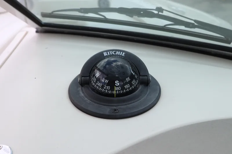 Slide: The Image of Ritchie compass on the dashboard of a 2007 Sea Ray 240 Sundeck boat. - 28