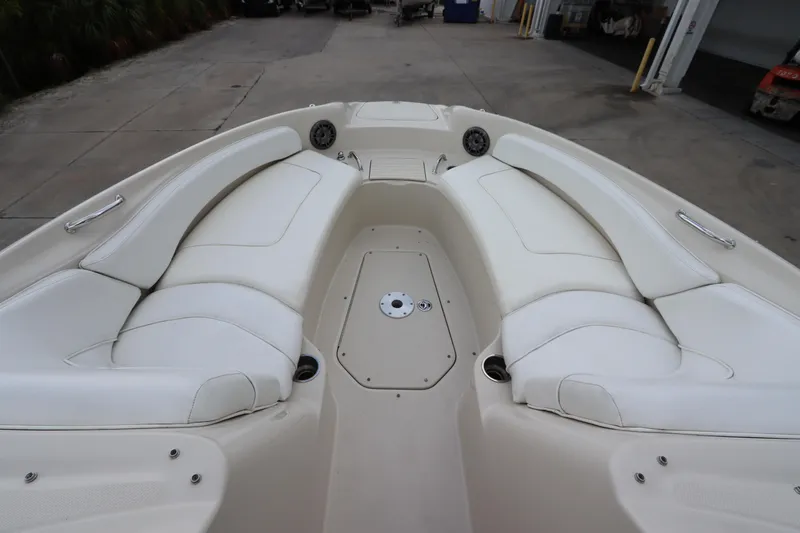 Slide: The Image of 2007 Sea Ray 240 Sundeck boat with spacious white seating area. - 31
