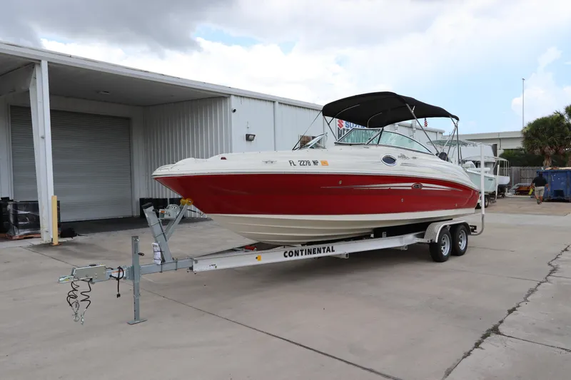 Slide: The Image of 2007 Sea Ray 240 Sundeck boat on a Continental trailer in a storage facility. - 7