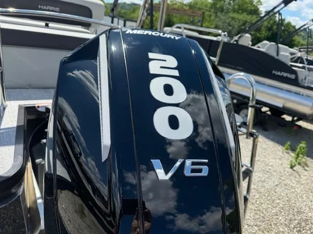 Slide: The Image of 2024 Harris Cruiser 230 with Mercury 200 V6 outboard engine. - 2