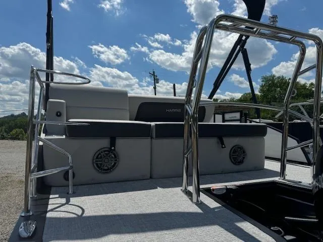 Slide: The Image of 2024 Harris Cruiser 230 boat interior with seating and stainless steel railings. - 3
