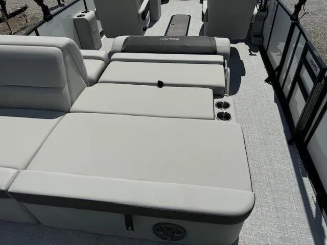 Slide: The Image of 2024 Harris Cruiser 230 boat interior with spacious seating and cup holders. - 9