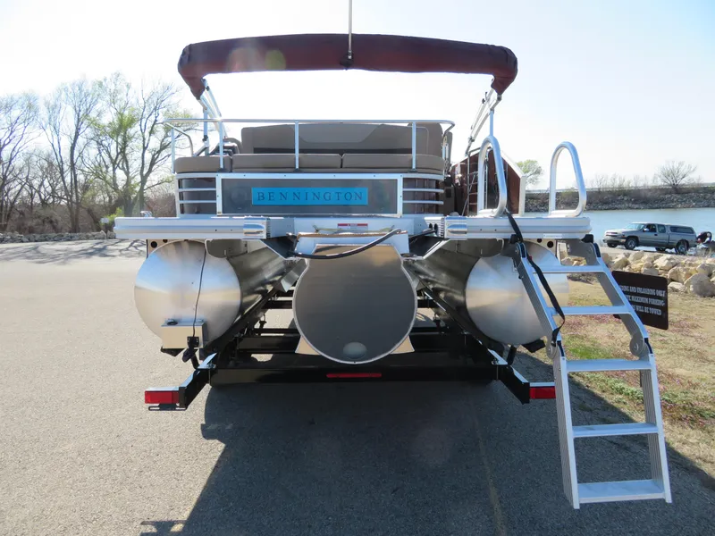 Slide: The Image of 2024 Bennington 22SXSB pontoon boat rear view with ladder and seating. - 4