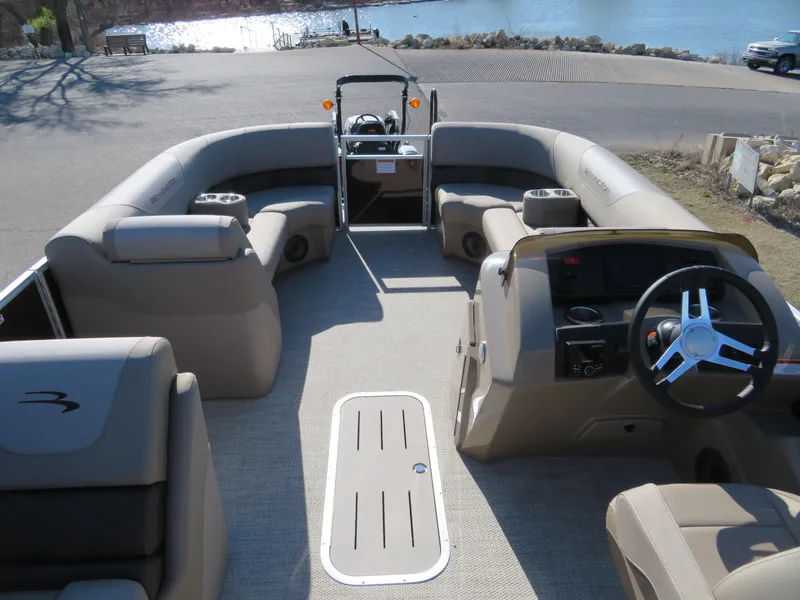 Slide: The Image of 2024 Bennington 22SXSB pontoon boat interior with spacious seating and modern helm. - 7