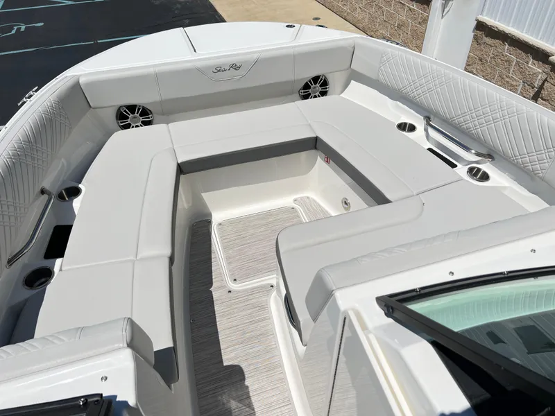 Slide: The Image of 2025 Sea Ray SDX 270 boat interior with spacious seating and modern design. - 11