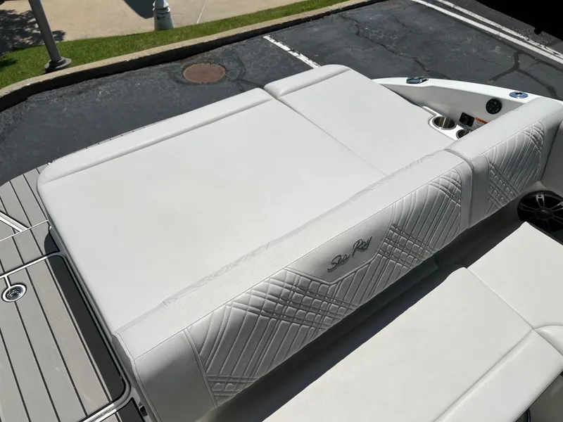 Slide: The Image of 2025 Sea Ray SDX 270 boat with white cushioned seating. - 13
